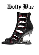 A black gothic-style high-heeled sandal with multiple cutout straps, silver-tone eyelets, and a spiked heel, shown on a plain white background with the text 'Dolly Bae' above it.