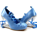 A pair of light blue satin high-heeled shoes with clear crystal-like heels and blue ribbon laces, shown on a white background with the text 'Dolly Bae' above them.