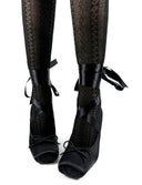 Black lace-up ankle boots with sheer patterned tights, shown on a white background with the text 'Dolly Bae' below.