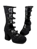 A pair of black gothic-style mid-calf boots with lace panels, buckle straps, and block heels, shown on a white background with the text 'Dolly Bae' above them.