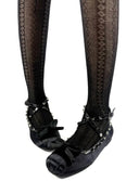 Black lace-up Mary Jane shoes with silver studs and bows, paired with black patterned knee-high socks, shown on a white background with the text 'Dolly Bae' below.