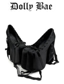 Black ballet shoe with a backpack on a white background, featuring the brand 'Dolly Bae'.