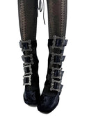 Black lace-up ankle boots with multiple silver buckle straps, shown on a white background with the text 'Dolly Bae' underneath.