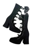 Black lace-up ankle boots with block heels and a black rose detail, shown on a white background with the text 'Dolly Bae' above.